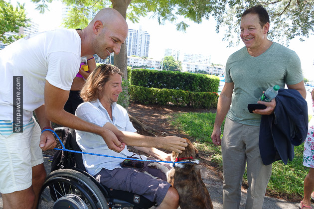 Russell Hartstein and Steve Guttenberg with man in wheel chair