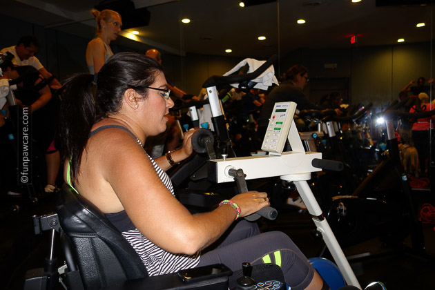 Disabled woman on modified bike in spin class