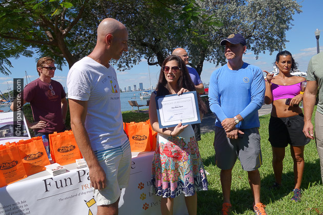 Russell Hartstein receiving award from mayor and commissioners of miami beach for service dog training
