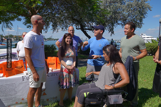 Russell Hartstein and Steve Guttenberg receiving best service dog training award from the city of miami beach
